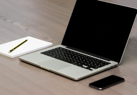 Free Silver Macbook Beside Iphone Stock Photo